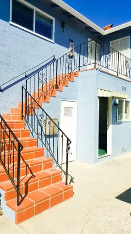 a front view of a house with large windows
