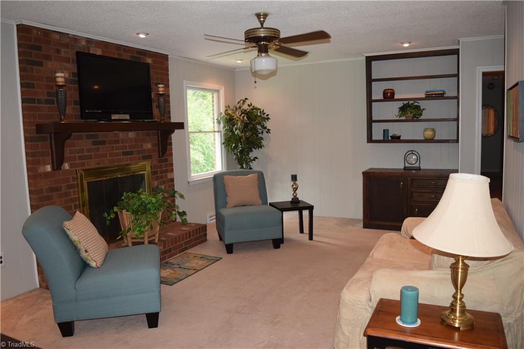 3510 Court Road Winston-Salem, NC 27106 - Photo 12 of 27 Updated Family room with freshly painted walls and striking brick fireplace with gas logs