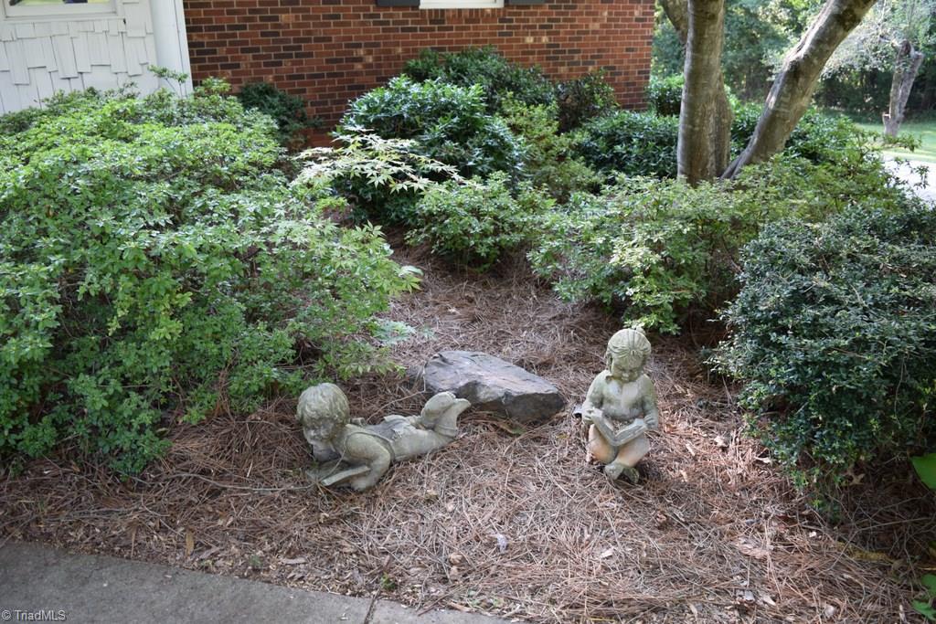 3510 Court Road Winston-Salem, NC 27106 - Photo 4 of 27 The yard has lovely landscaping and lots of shade to relax under on a hot day