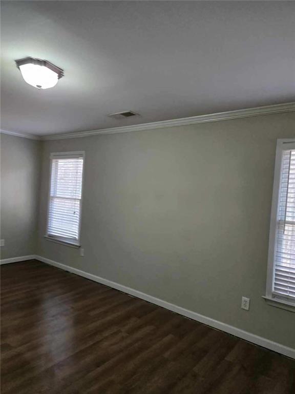 5315 Sherwin Drive Lilburn, GA 30047 - Photo 16 of 16 an empty room with wooden floor and windows