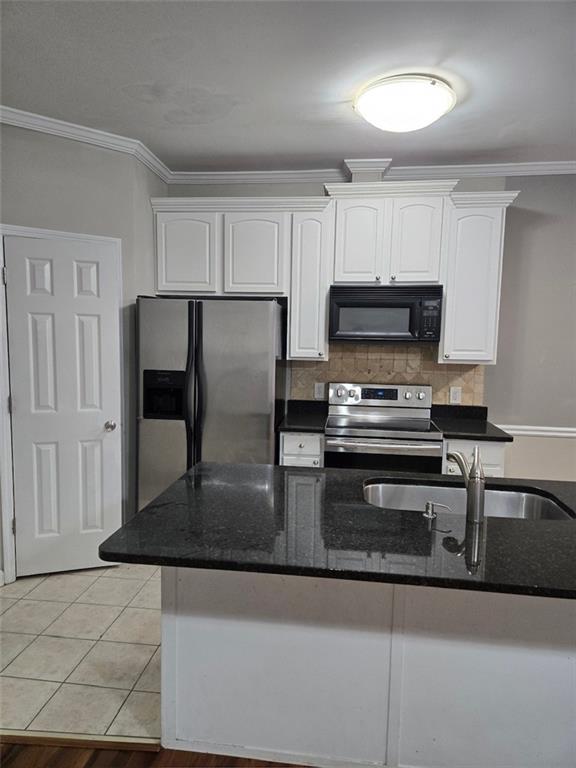 5315 Sherwin Drive Lilburn, GA 30047 - Photo 3 of 16 a kitchen with kitchen island a counter top space a sink and a stove