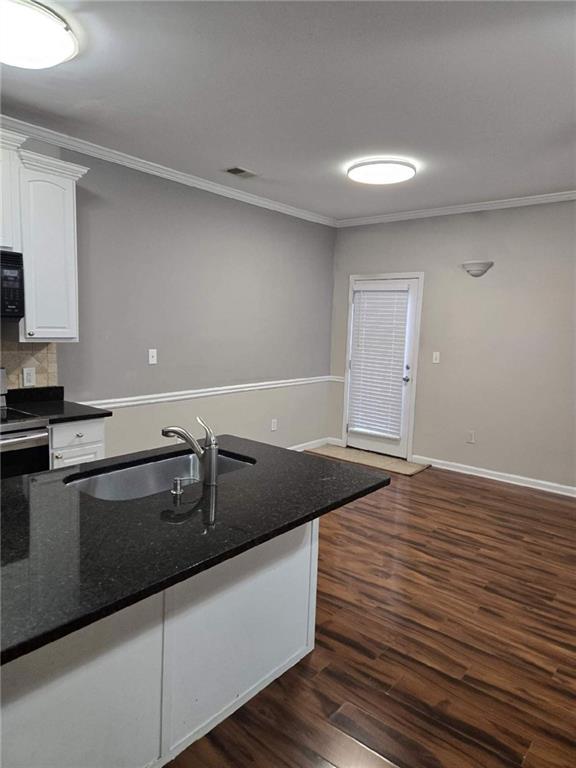5315 Sherwin Drive Lilburn, GA 30047 - Photo 4 of 16 a kitchen with granite countertop a sink and cabinets