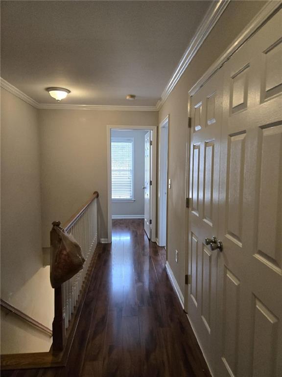 5315 Sherwin Drive Lilburn, GA 30047 - Photo 10 of 16 a view of a hallway with wooden floor and staircase