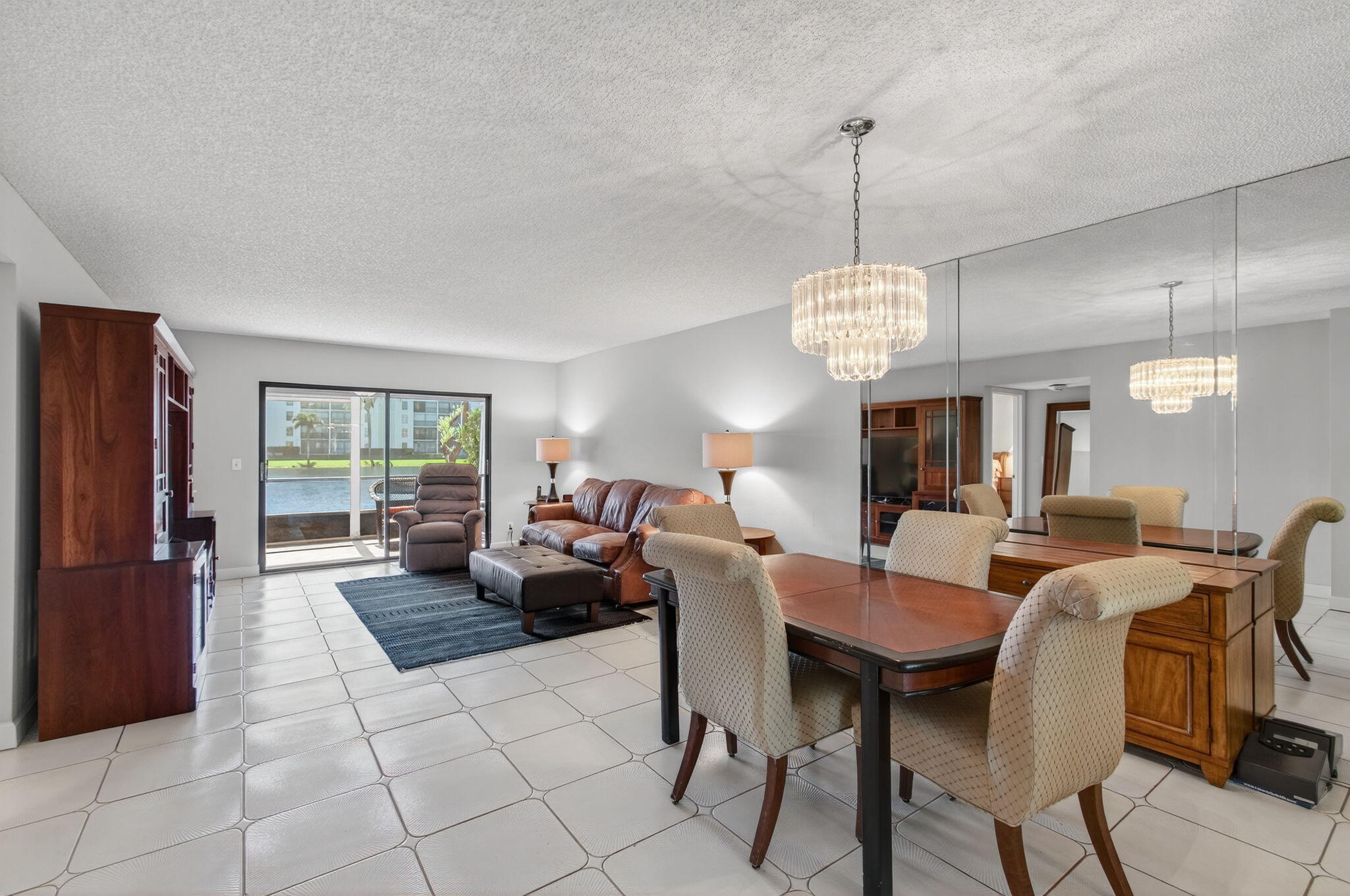 7340 Amberly Lane, Unit 101 Delray Beach, FL 33446 - Photo 13 of 90 a view of a dining room with furniture window and outside view