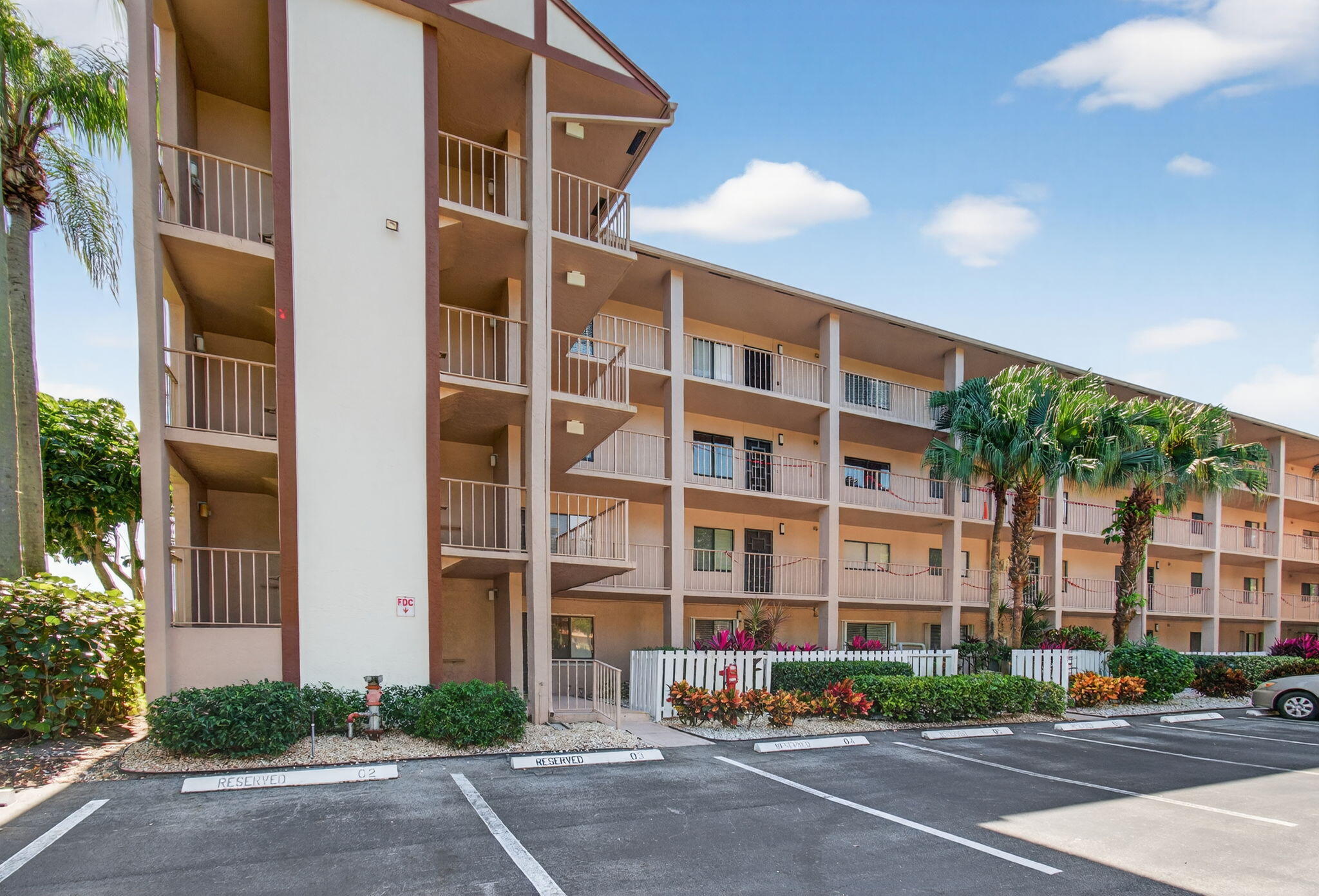 7340 Amberly Lane, Unit 101 Delray Beach, FL 33446 - Photo 2 of 90 a front view of a building with street view