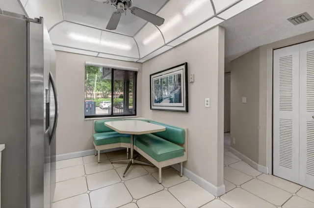 a bedroom with furniture and a ceiling fan