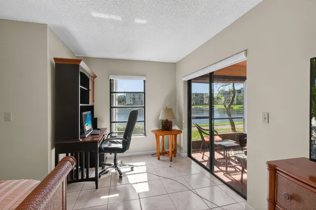 a view of a lake with houses in the back