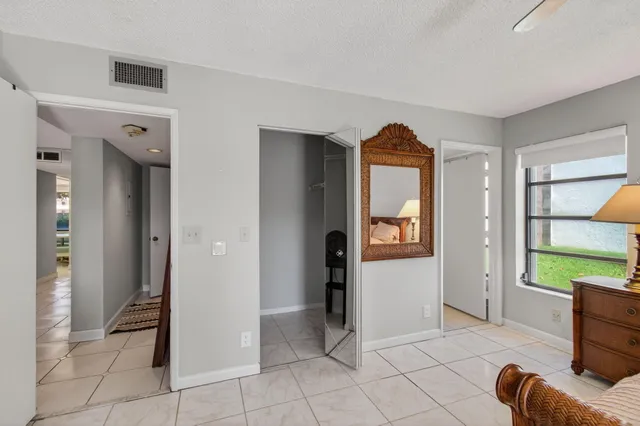 a view of a a dining room with furniture window and wooden floor