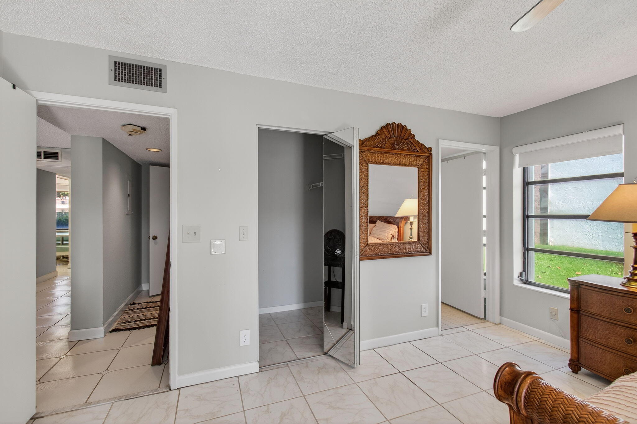 7340 Amberly Lane, Unit 101 Delray Beach, FL 33446 - Photo 40 of 90 a view of an entryway with wooden floor and windows