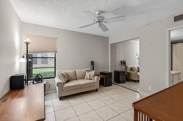 a view of a swimming pool with a yard