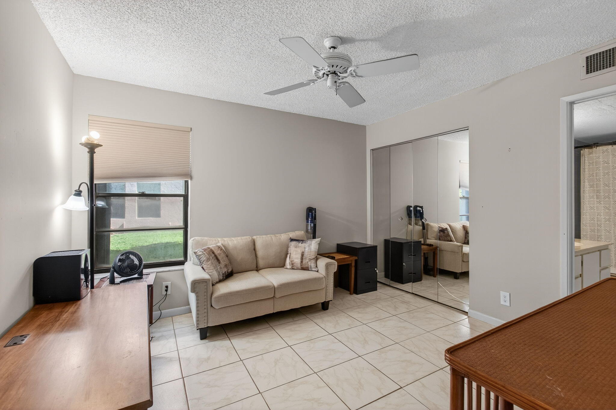 7340 Amberly Lane, Unit 101 Delray Beach, FL 33446 - Photo 44 of 90 a living room with furniture and a window