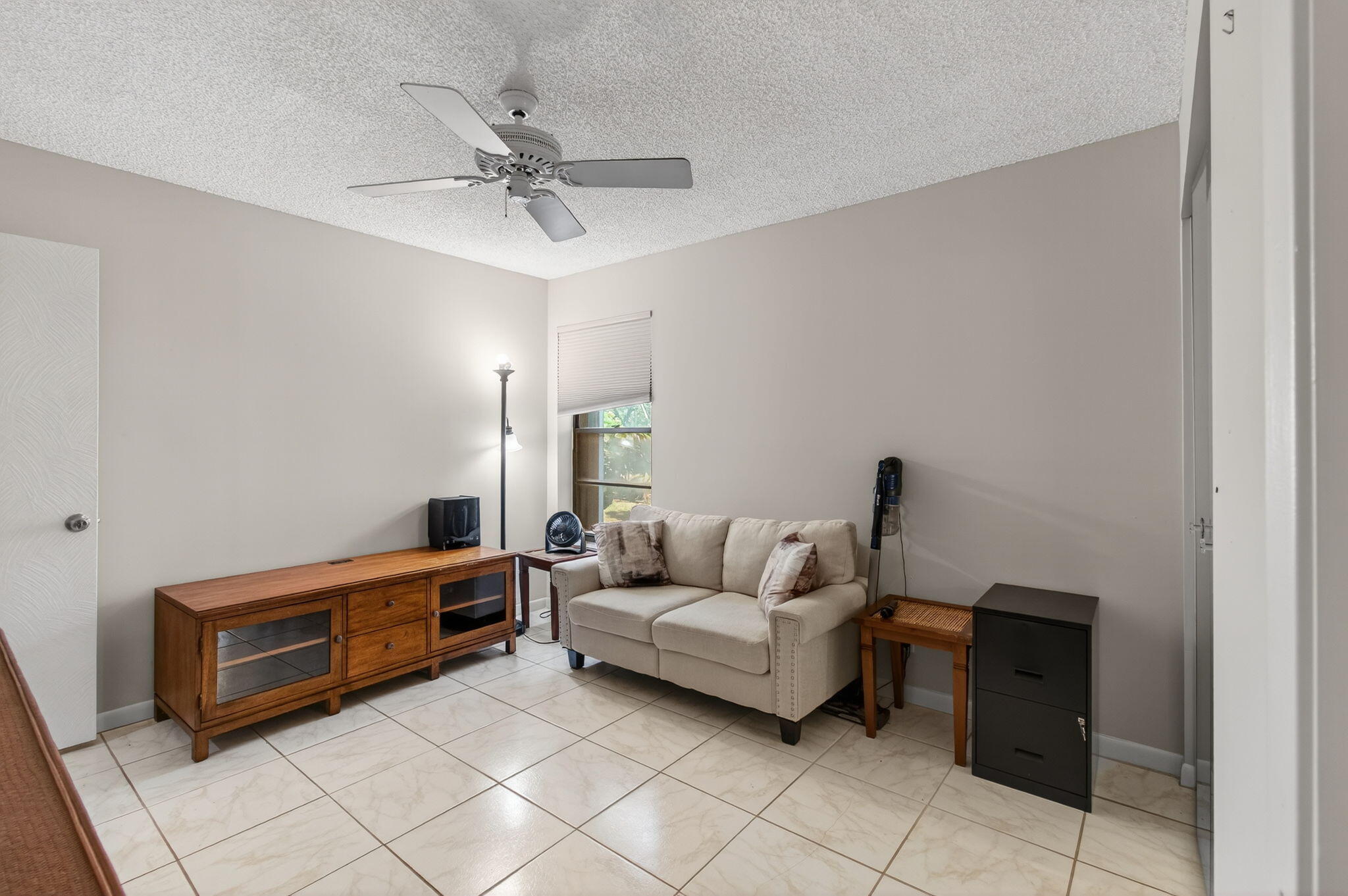 7340 Amberly Lane, Unit 101 Delray Beach, FL 33446 - Photo 45 of 90 a living room with furniture and white walls