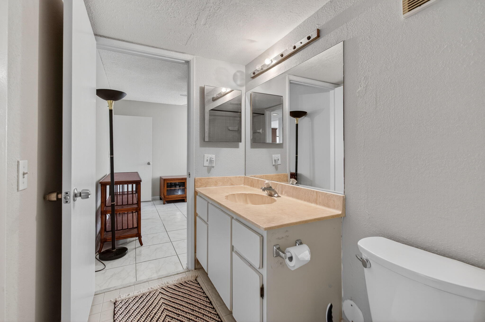 7340 Amberly Lane, Unit 101 Delray Beach, FL 33446 - Photo 50 of 90 a bathroom with a sink a toilet and shower