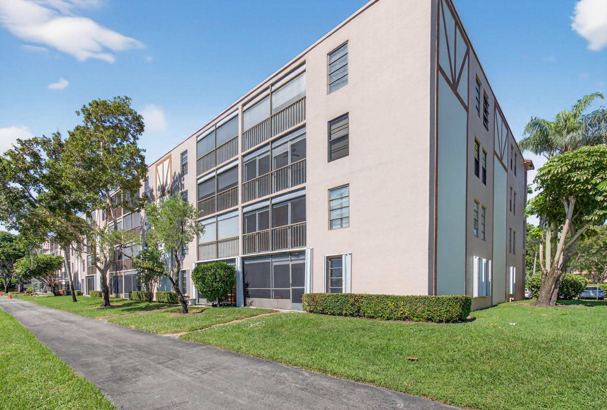 7340 Amberly Lane, Unit 101 Delray Beach, FL 33446 - Photo 53 of 90 a view of a building with a yard