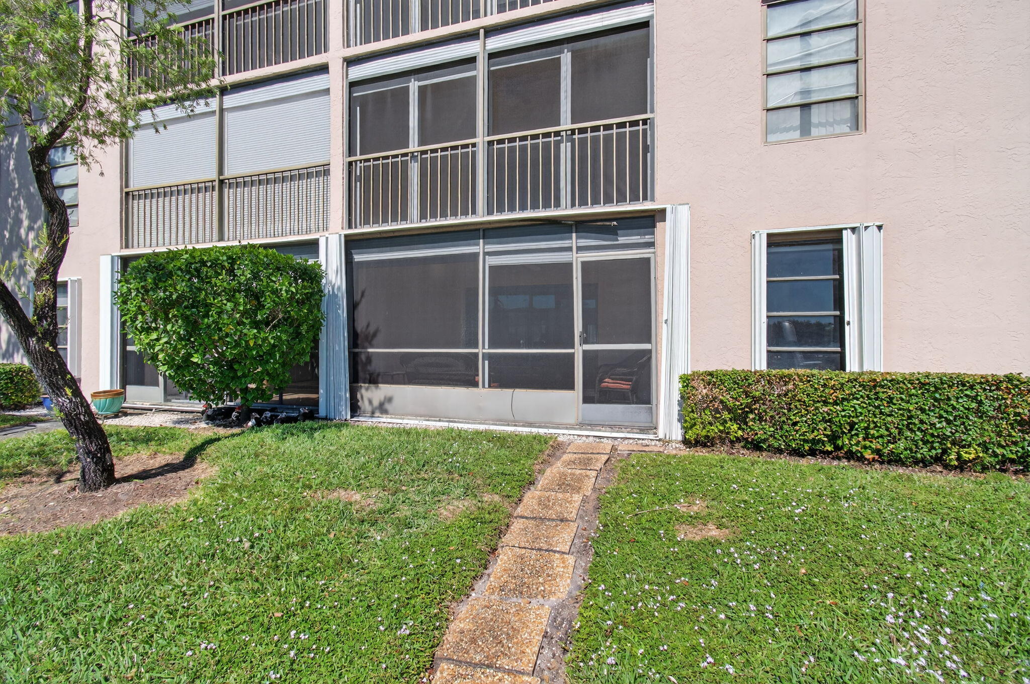 7340 Amberly Lane, Unit 101 Delray Beach, FL 33446 - Photo 57 of 90 a view of a house with backyard and porch
