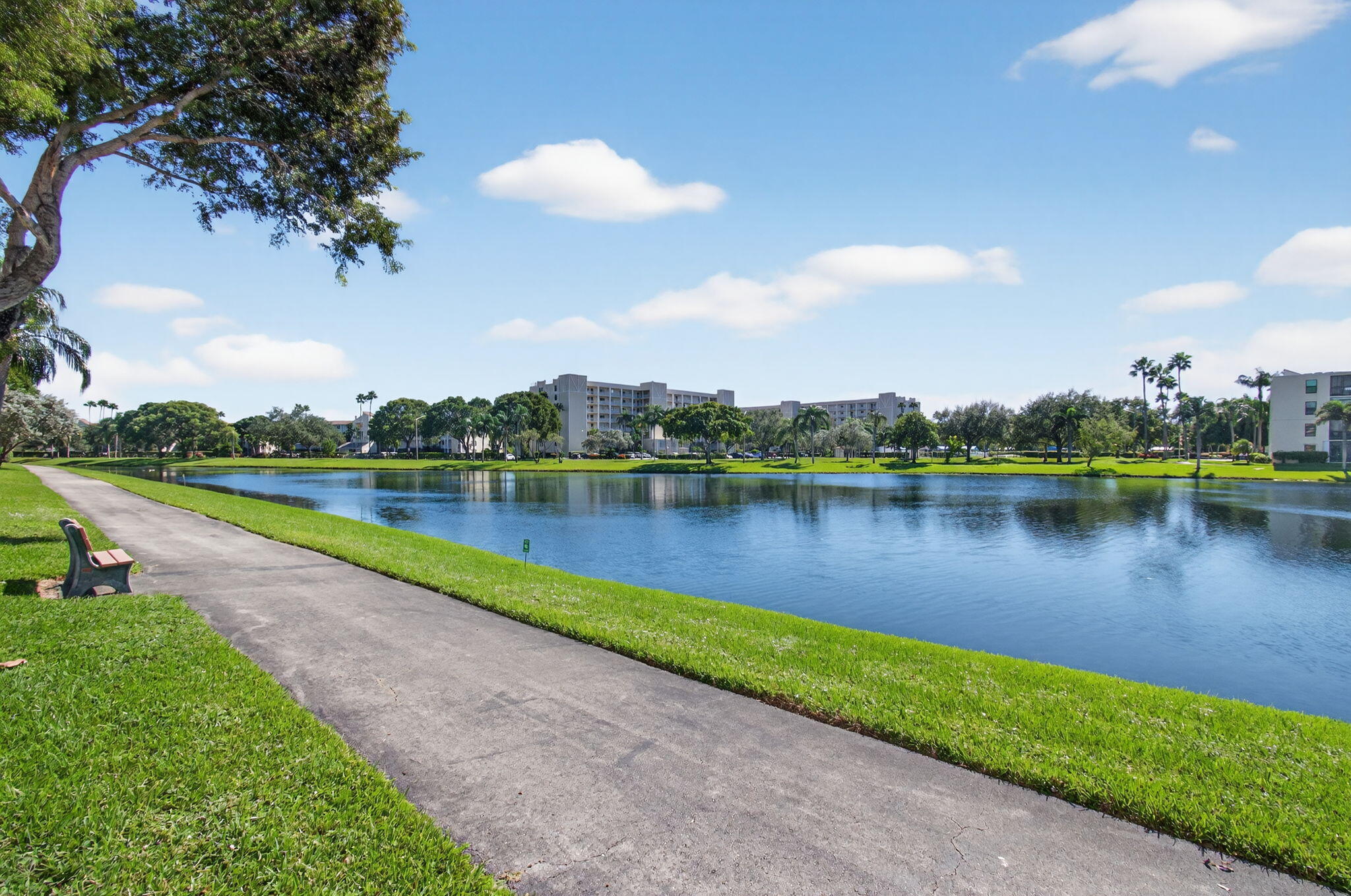 7340 Amberly Lane, Unit 101 Delray Beach, FL 33446 - Photo 60 of 90 a view of a lake with a city