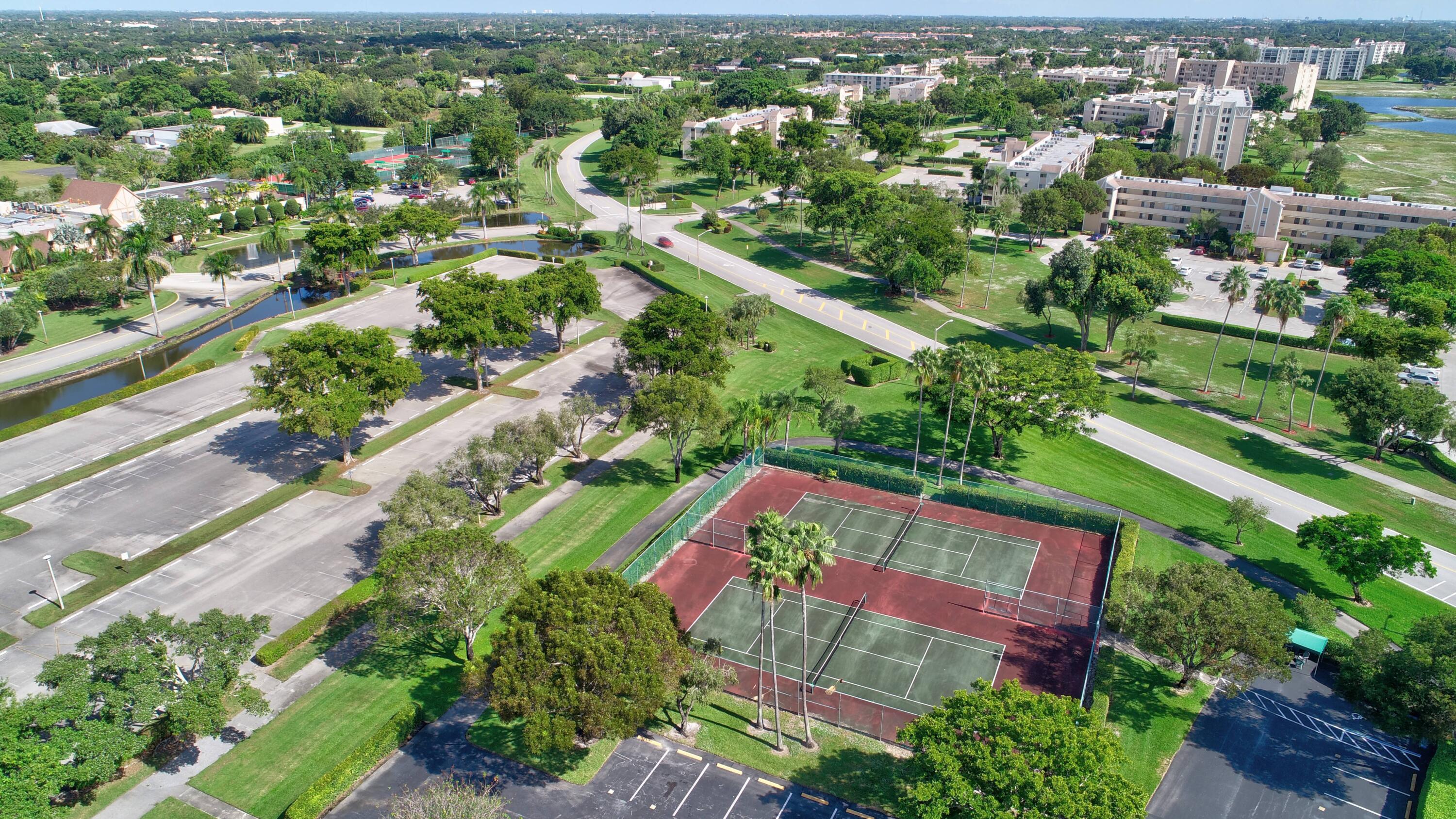 7340 Amberly Lane, Unit 101 Delray Beach, FL 33446 - Photo 88 of 90 an aerial view of residential houses with outdoor space and street view