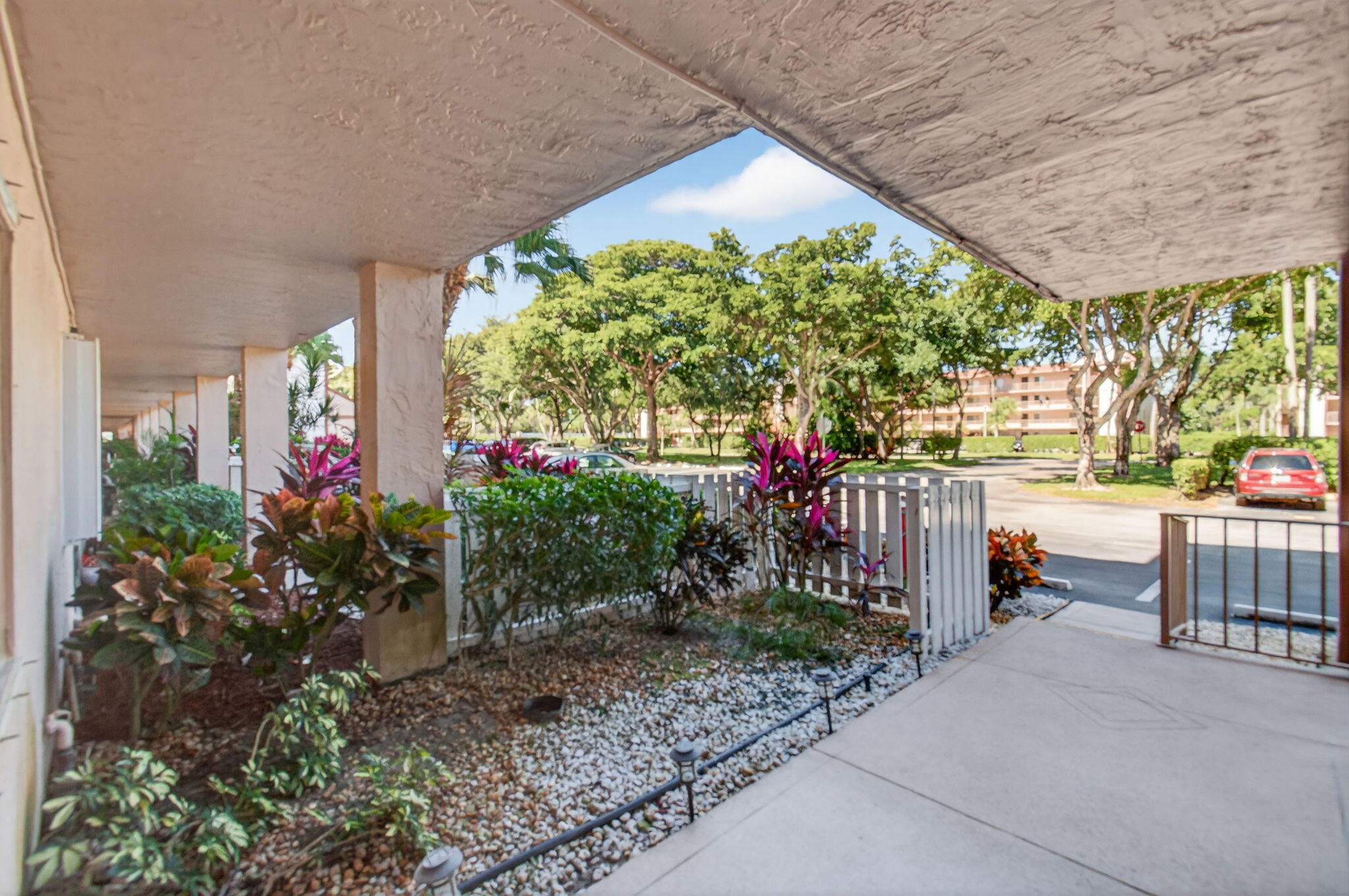7340 Amberly Lane, Unit 101 Delray Beach, FL 33446 - Photo 9 of 90 a garden view with a seating space