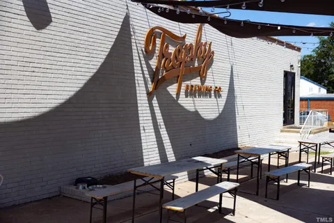 a view of a chairs and a table in the balcony
