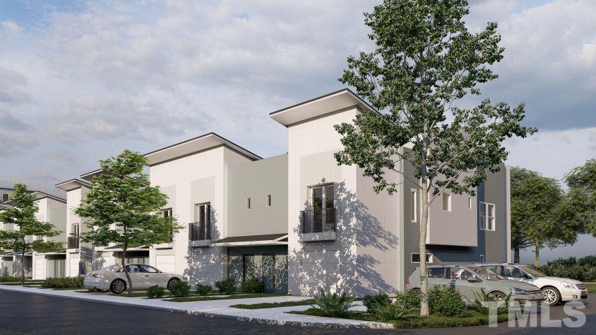 1412 Sawyer Road, Unit C11 Raleigh, NC 27610 - Photo 2 of 36 a front view of a house with garden