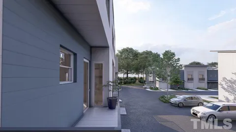 a backyard of a house with outdoor seating