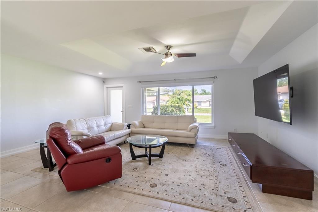 2100 55th Street Southwest Naples, FL 34116 - Photo 22 of 50 a living room with furniture and a window