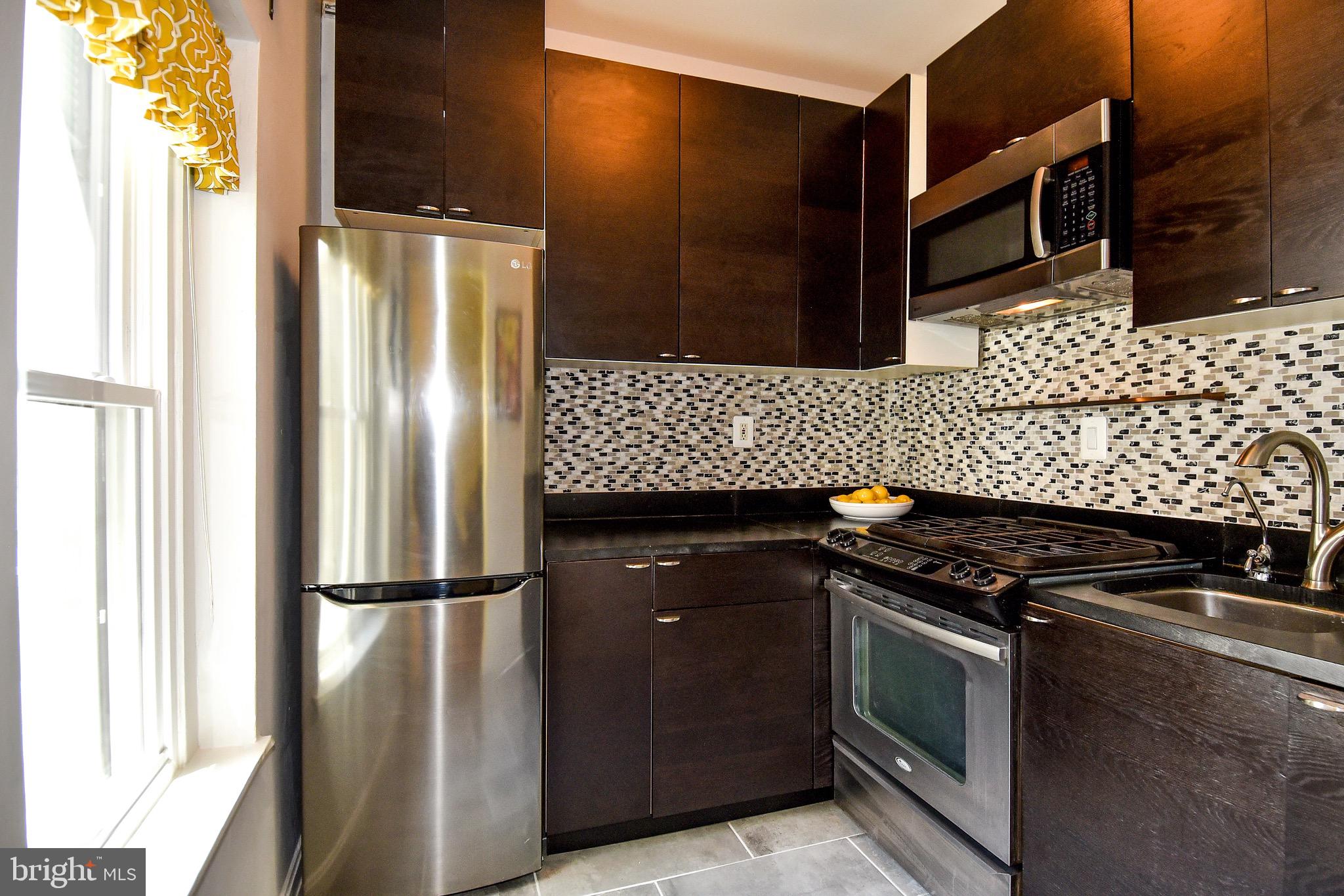 1669 Columbia Road Northwest, Unit 409 Washington, DC 20009 - Photo 6 of 47 Updated Kitchen With A Large Window