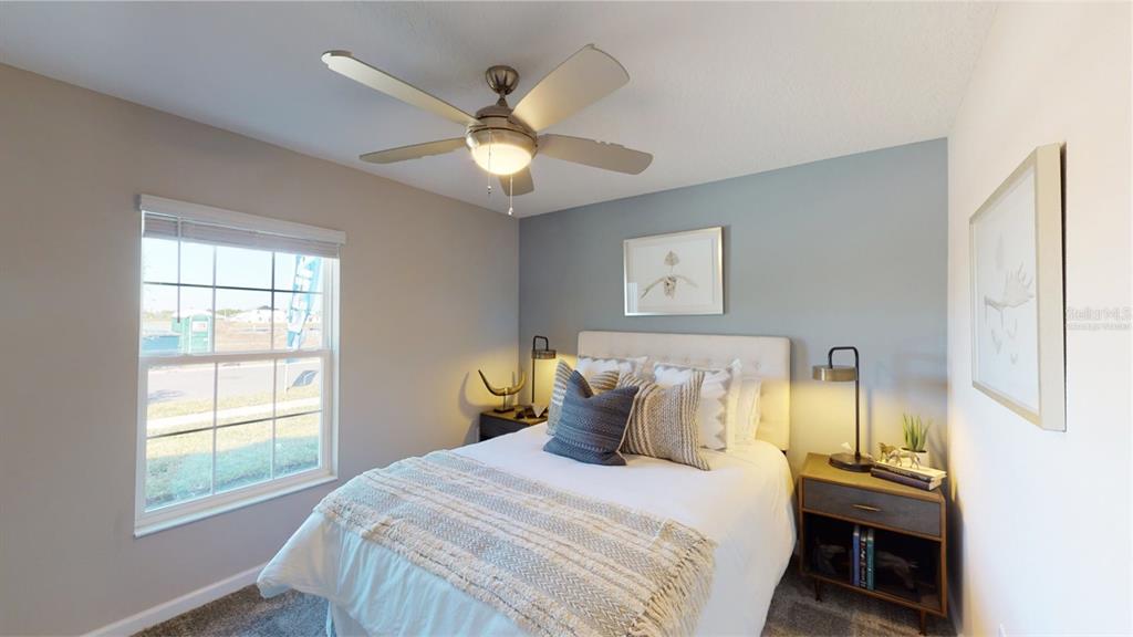 4754 Maple Cross Drive Kissimmee, FL 34746 - Photo 5 of 19 a bedroom with a bed and a window