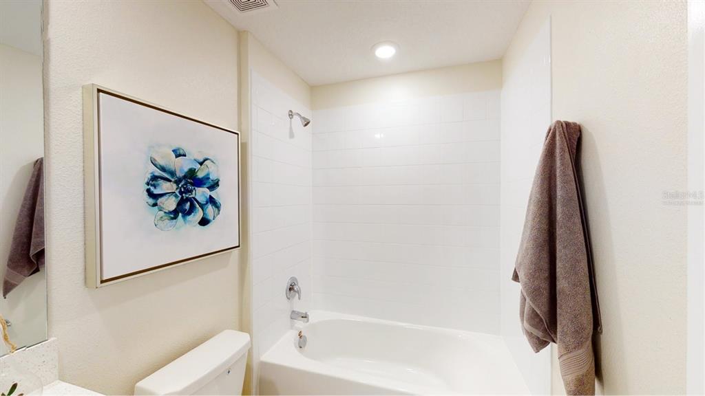 4754 Maple Cross Drive Kissimmee, FL 34746 - Photo 6 of 19 a view of a bathtub in a bathroom