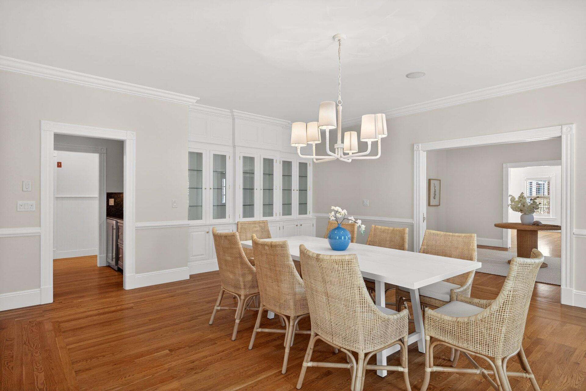 44 Seapuit Road Osterville, MA 02655 - Photo 12 of 33 a view of a dining room with furniture a chandelier and wooden floor