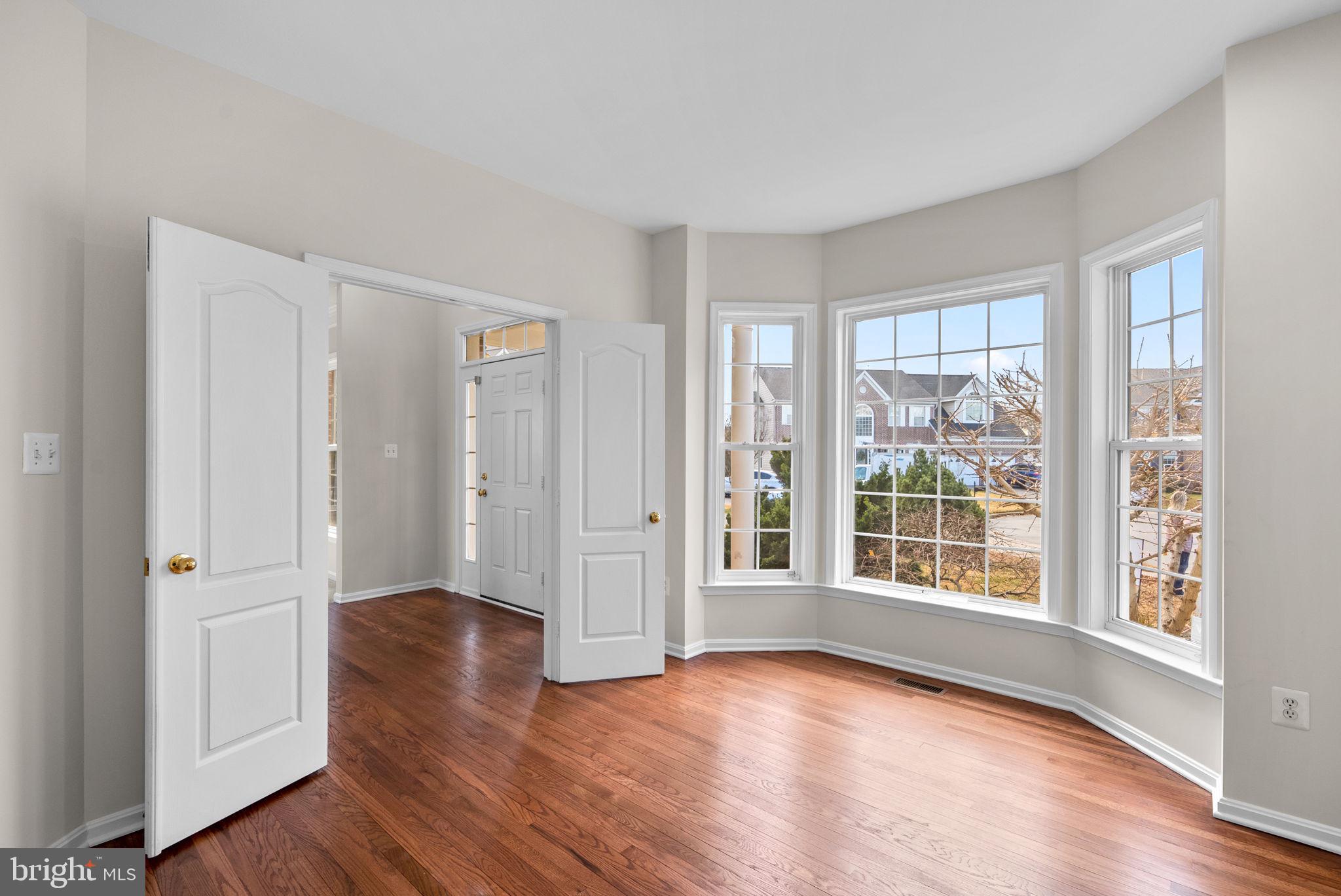 7604 Finglas Court Laurel, MD 20707 - Photo 23 of 48 wooden floor in an empty room with a window