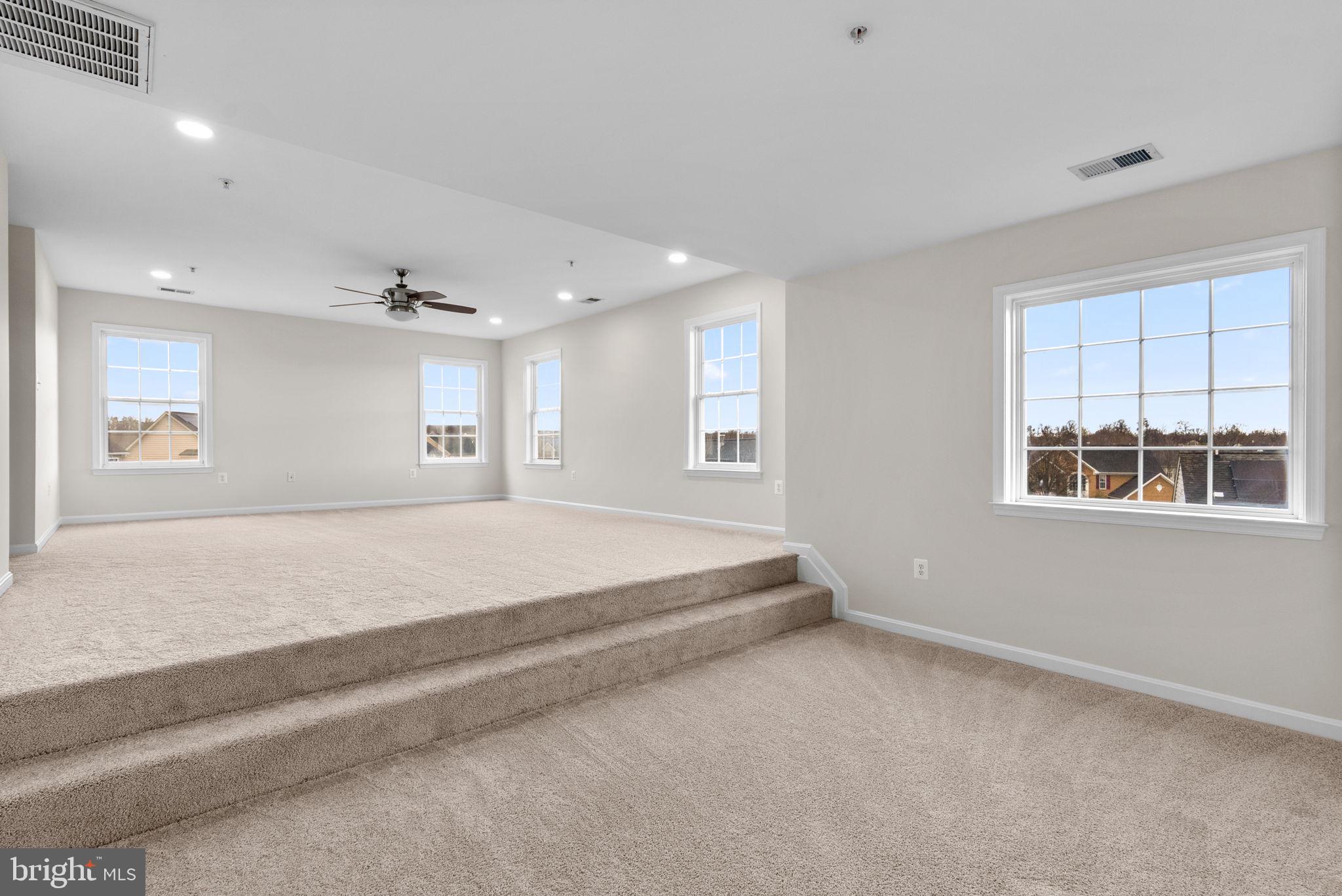 7604 Finglas Court Laurel, MD 20707 - Photo 26 of 48 a spacious bedroom with a large bed and a window