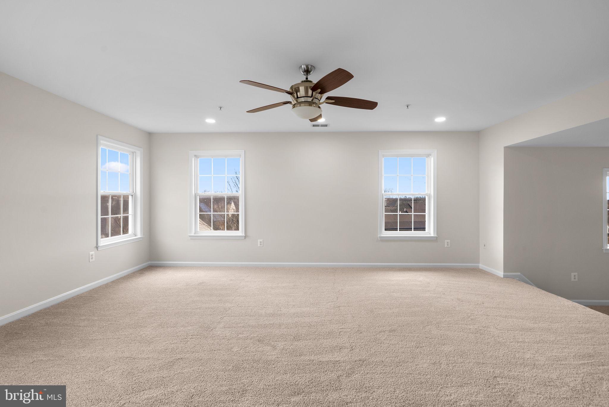7604 Finglas Court Laurel, MD 20707 - Photo 27 of 48 a view of a livingroom with a ceiling fan and window