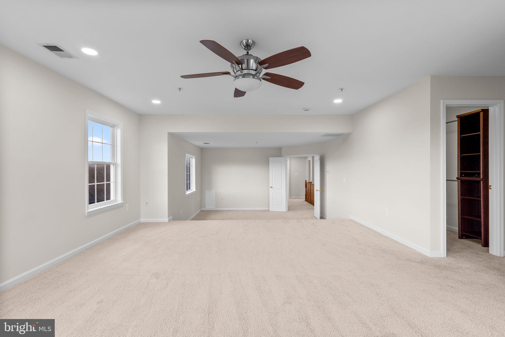 7604 Finglas Court Laurel, MD 20707 - Photo 28 of 48 a view of a livingroom with a ceiling fan and window
