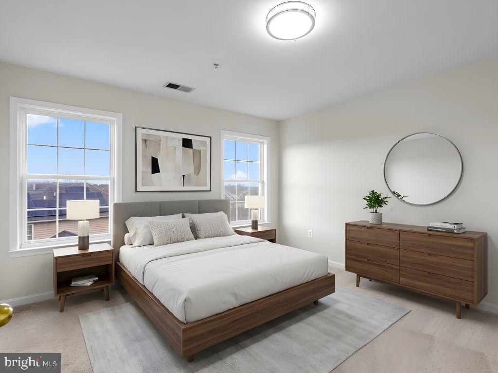 7604 Finglas Court Laurel, MD 20707 - Photo 35 of 48 a bedroom with a bed and a dresser