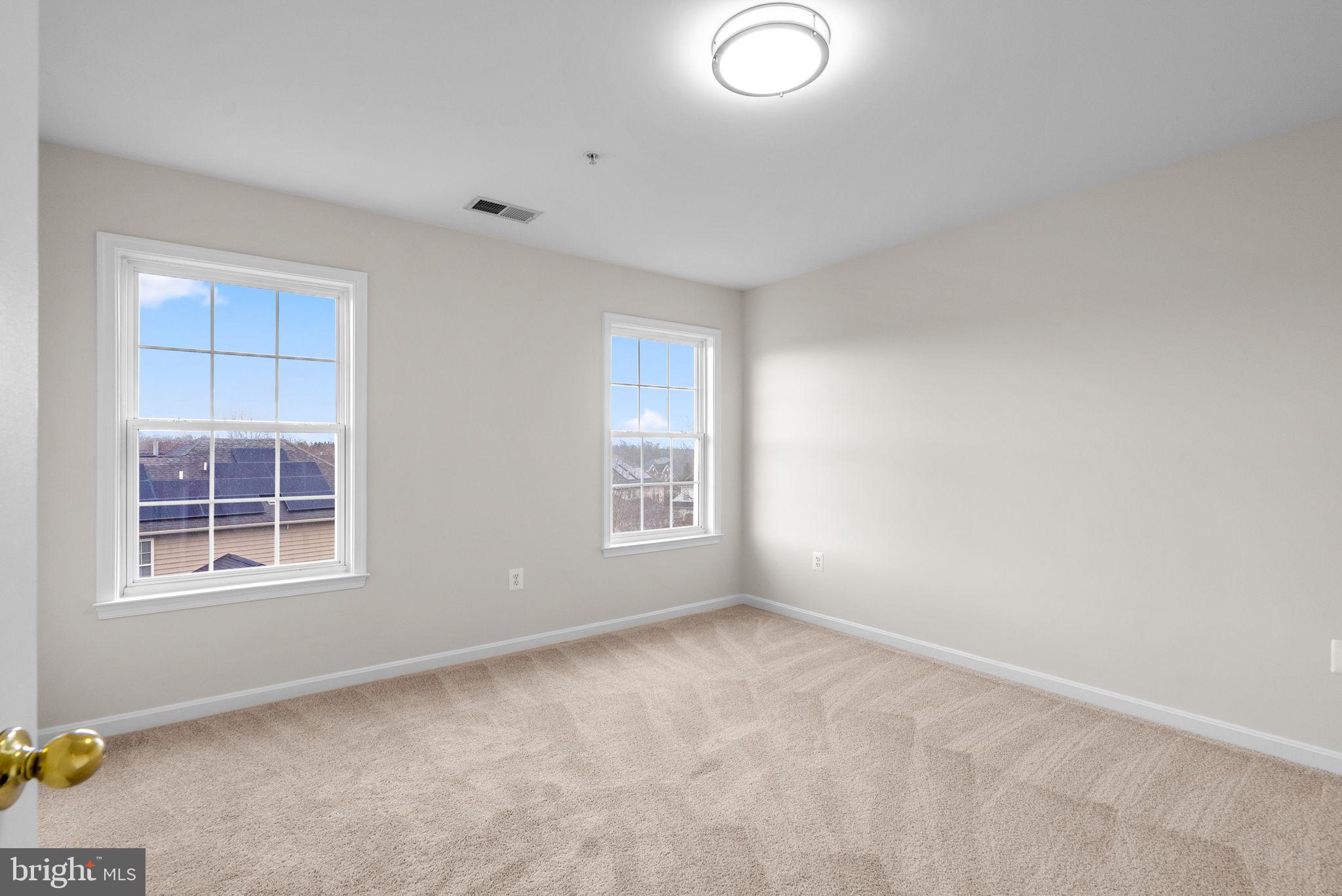 7604 Finglas Court Laurel, MD 20707 - Photo 36 of 48 an empty room with windows