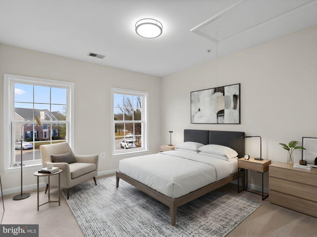 7604 Finglas Court Laurel, MD 20707 - Photo 38 of 48 a bedroom with a bed wooden floor and window