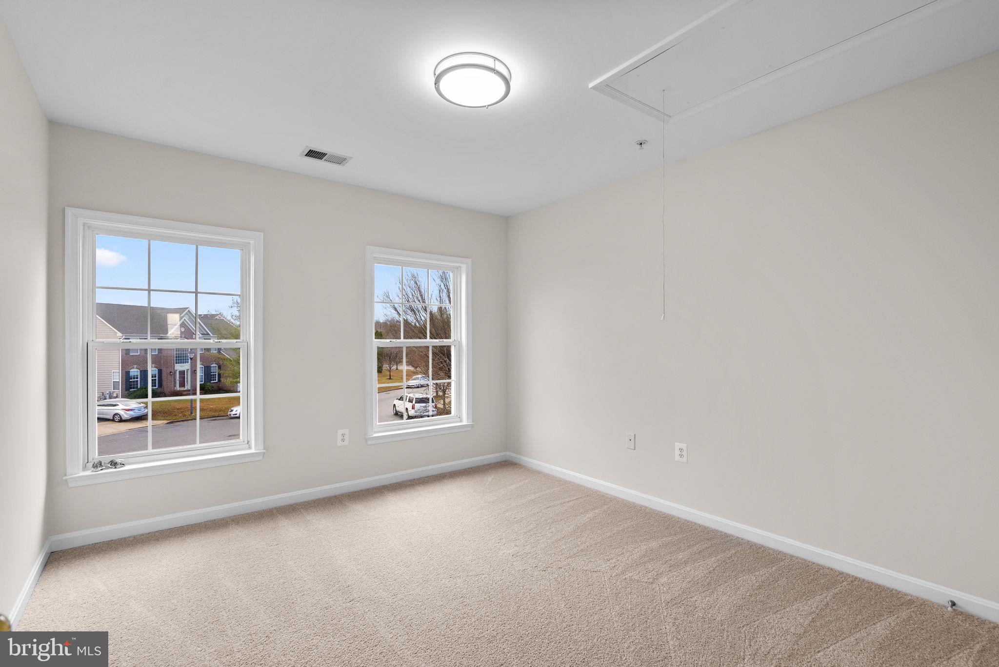 7604 Finglas Court Laurel, MD 20707 - Photo 39 of 48 an empty room with windows and closet