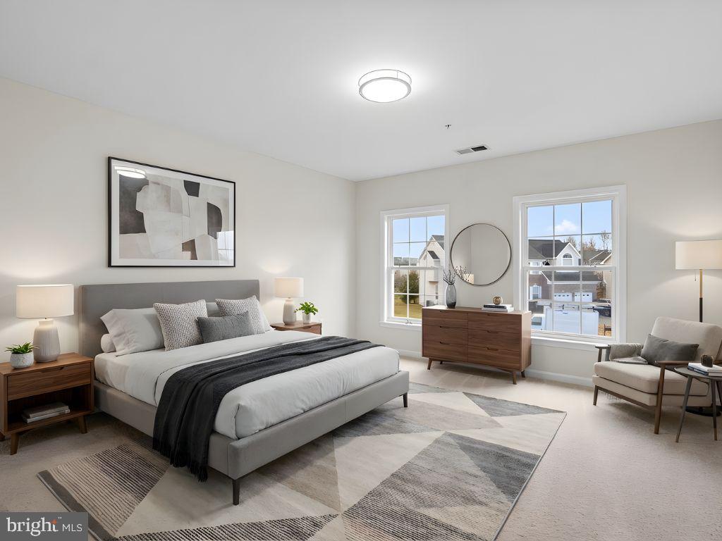 7604 Finglas Court Laurel, MD 20707 - Photo 42 of 48 a bedroom with a bed a couch and dresser