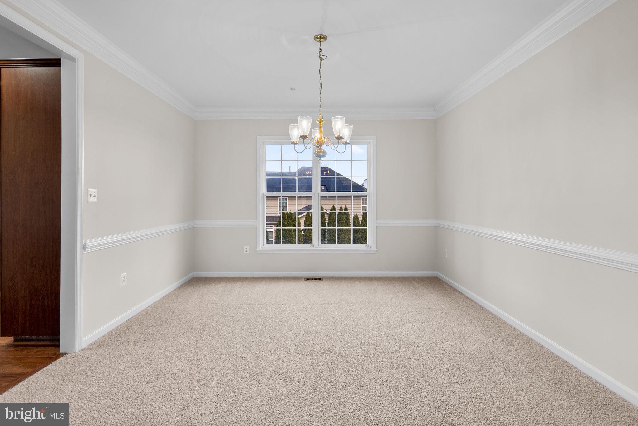 7604 Finglas Court Laurel, MD 20707 - Photo 6 of 48 a view of an empty room with a window