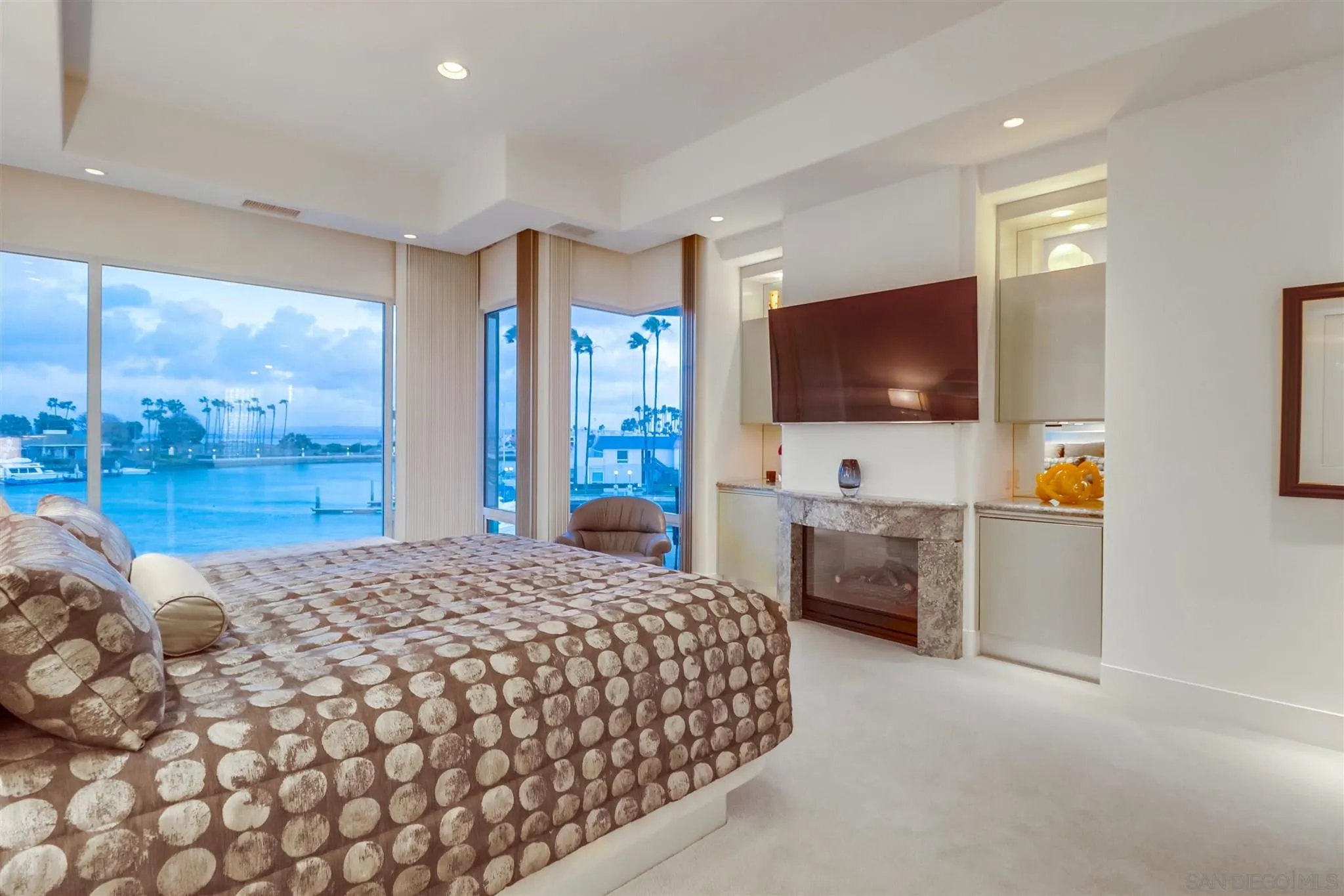 2 Green Turtle Road Coronado, CA 92118 - Photo 17 of 54 a bedroom with a large bed and a flat screen tv