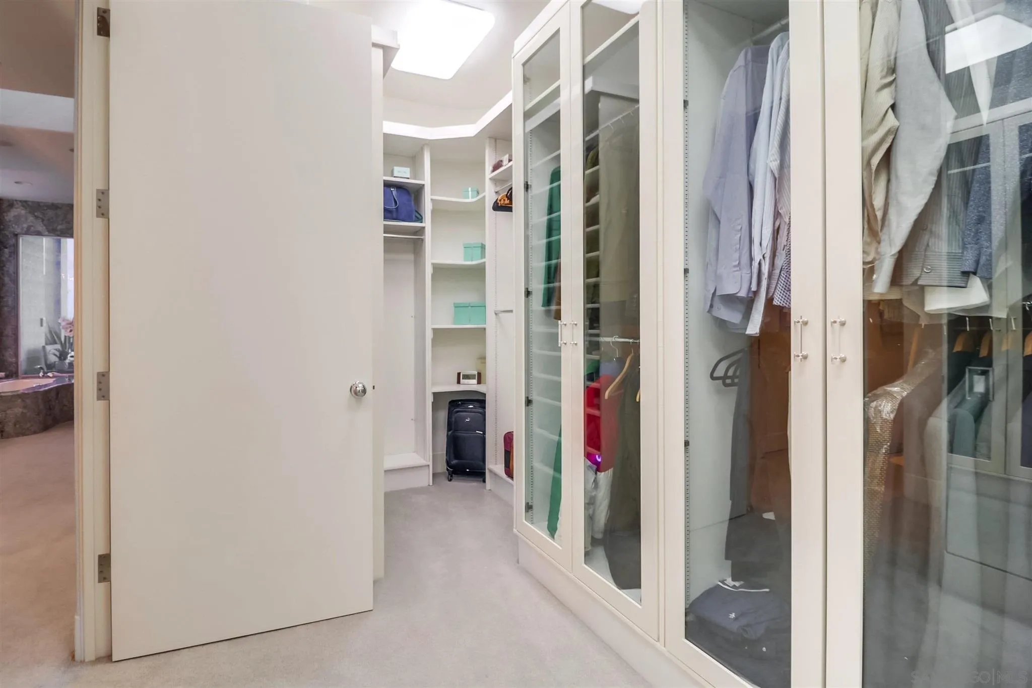 2 Green Turtle Road Coronado, CA 92118 - Photo 21 of 54 a view of a walk in closet and bathroom