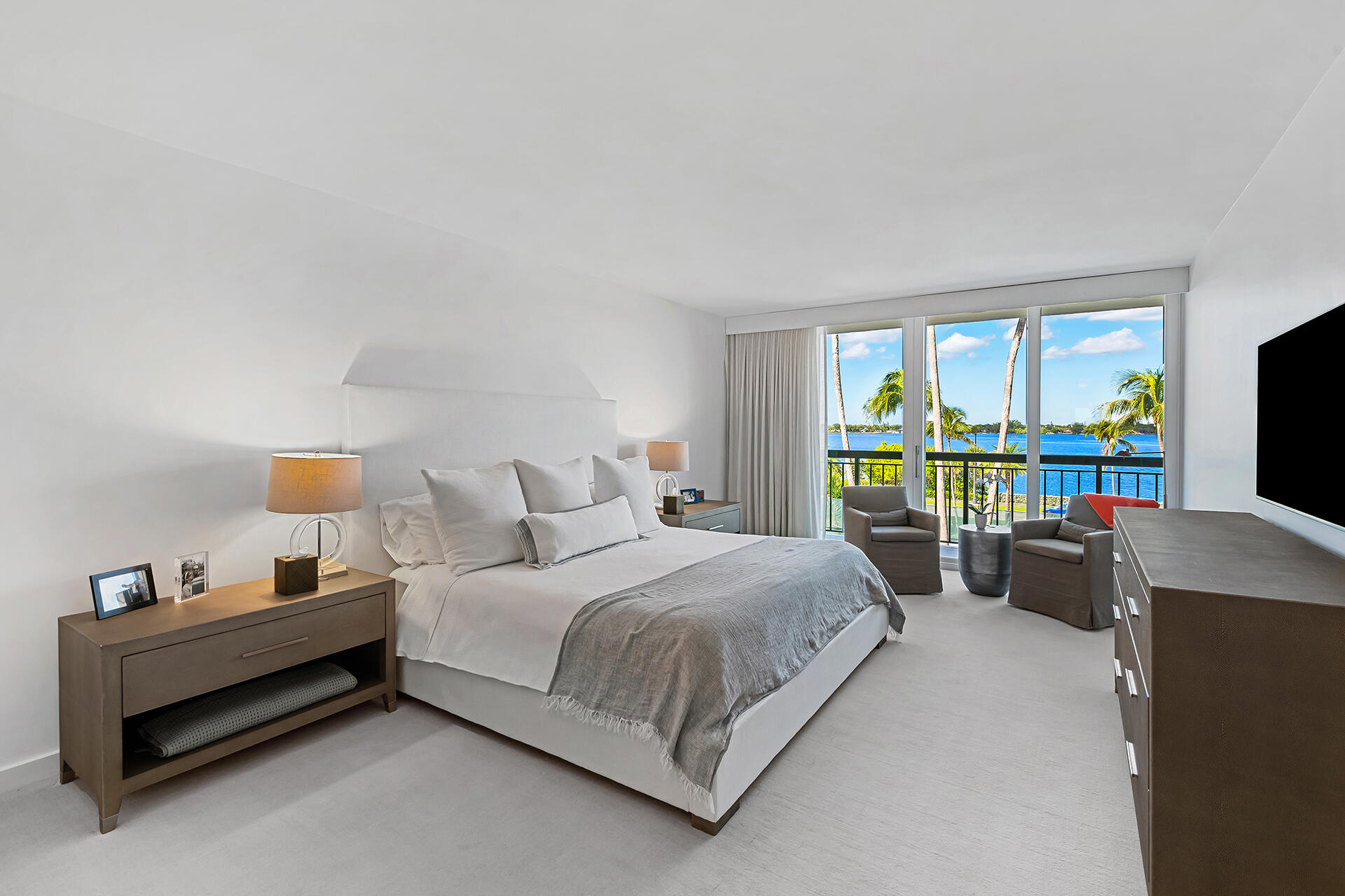 3140 South Ocean Boulevard, Unit 307S Palm Beach, FL 33480 - Photo 14 of 58 a bedroom with a bed and large windows