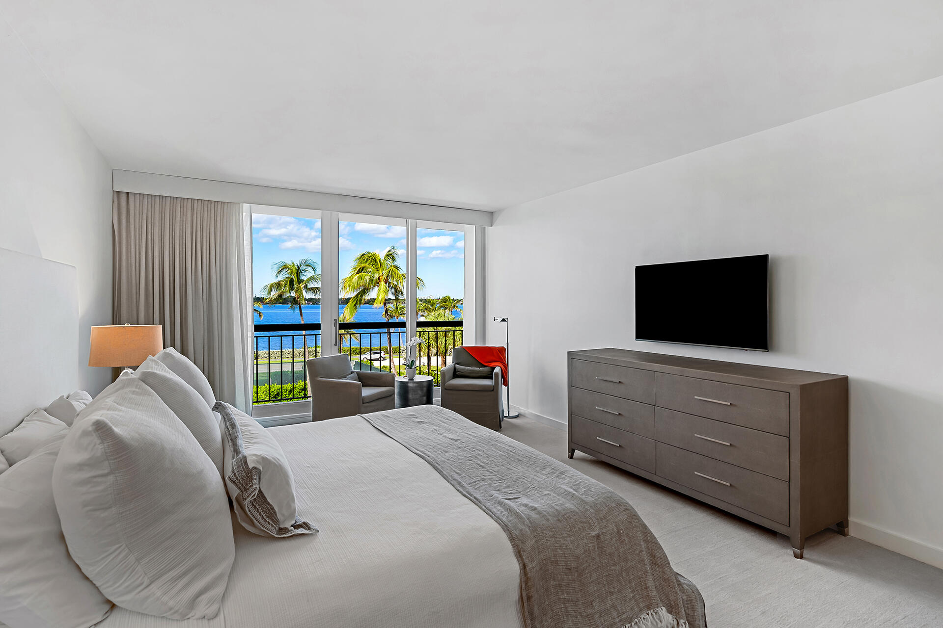 3140 South Ocean Boulevard, Unit 307S Palm Beach, FL 33480 - Photo 15 of 58 a bedroom with a bed and a flat screen tv