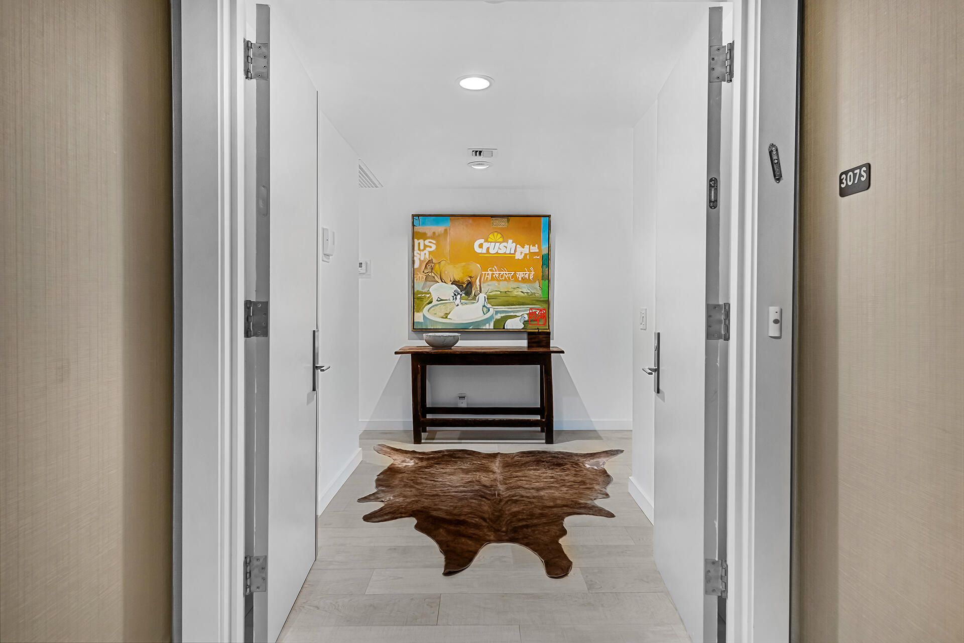 3140 South Ocean Boulevard, Unit 307S Palm Beach, FL 33480 - Photo 24 of 58 a living room with furniture and a flat screen tv