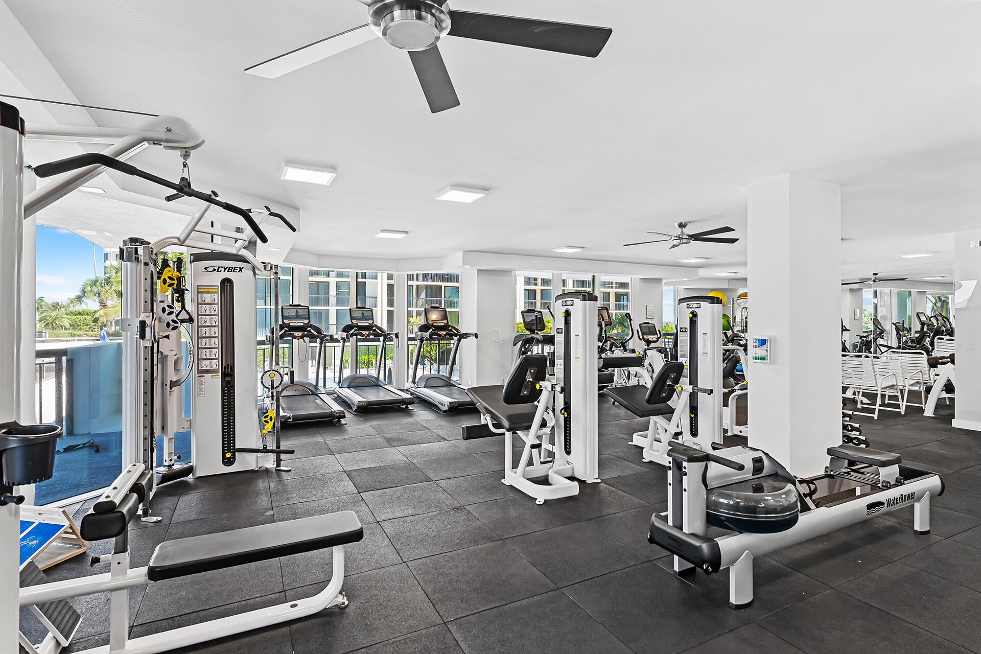 3140 South Ocean Boulevard, Unit 307S Palm Beach, FL 33480 - Photo 36 of 58 a room with gym equipment and windows