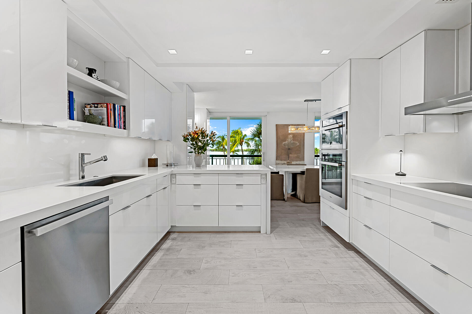 3140 South Ocean Boulevard, Unit 307S Palm Beach, FL 33480 - Photo 8 of 58 a kitchen with cabinets and window