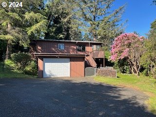 29280 Lacy Street Gold Beach, OR 97444 - Photo 1 of 38 a small pool with a yard