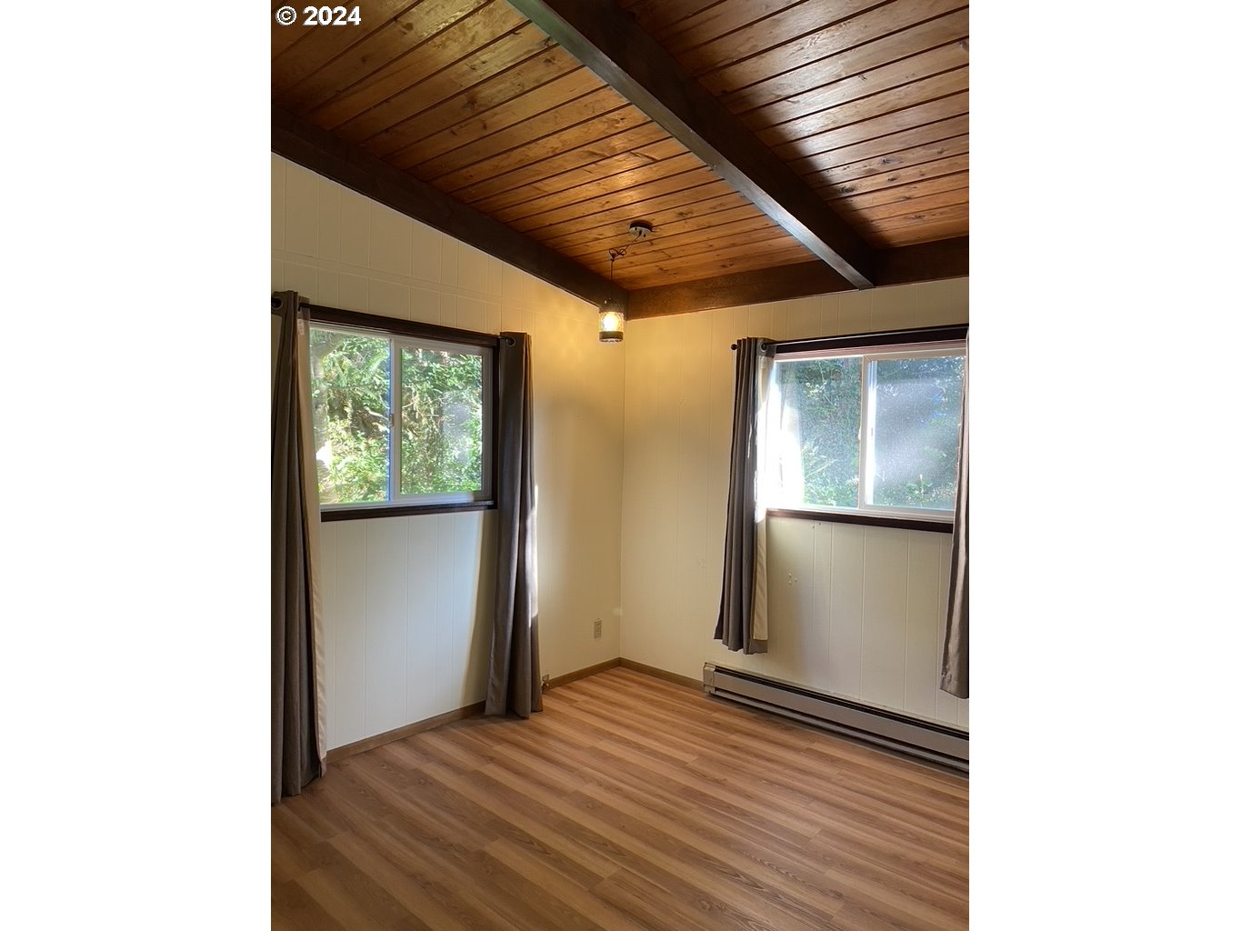 29280 Lacy Street Gold Beach, OR 97444 - Photo 21 of 38 a view of a livingroom with wooden floor and a window