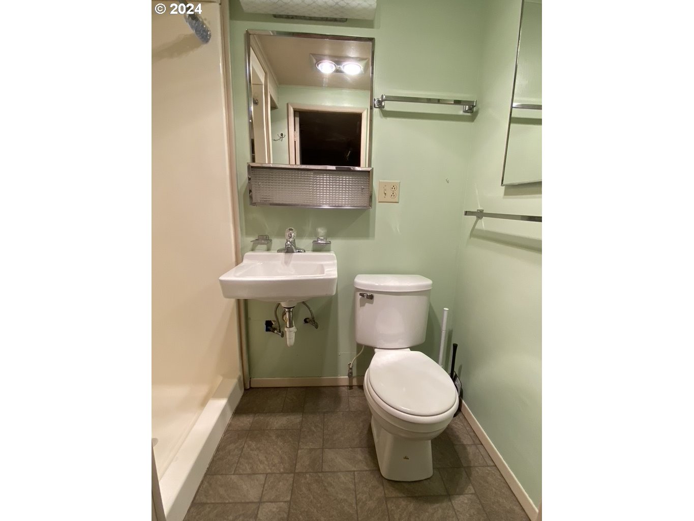 29280 Lacy Street Gold Beach, OR 97444 - Photo 22 of 38 a bathroom with a toilet sink and mirror